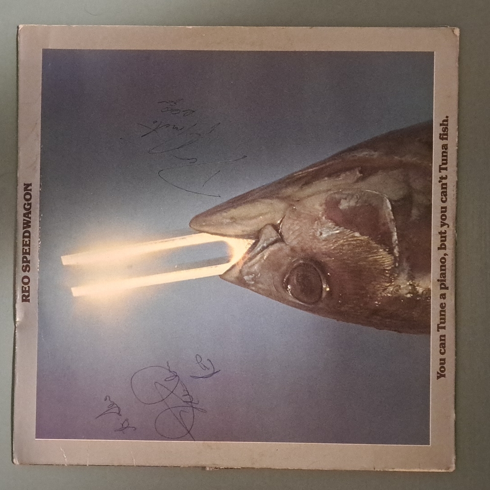 Autographed Reo Speedwagon Album